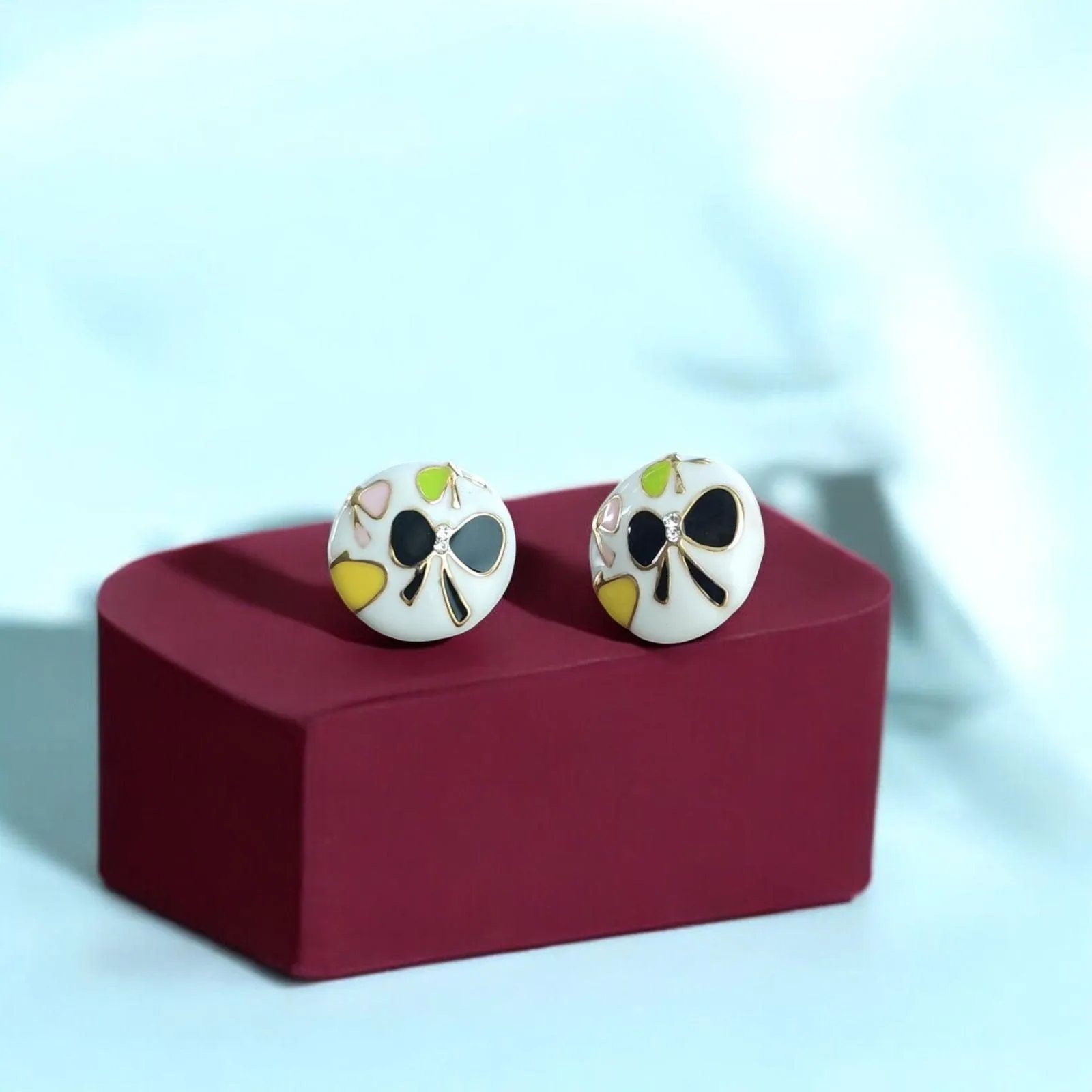 Floral White Stud Earrings with Black Butterfly Motifs